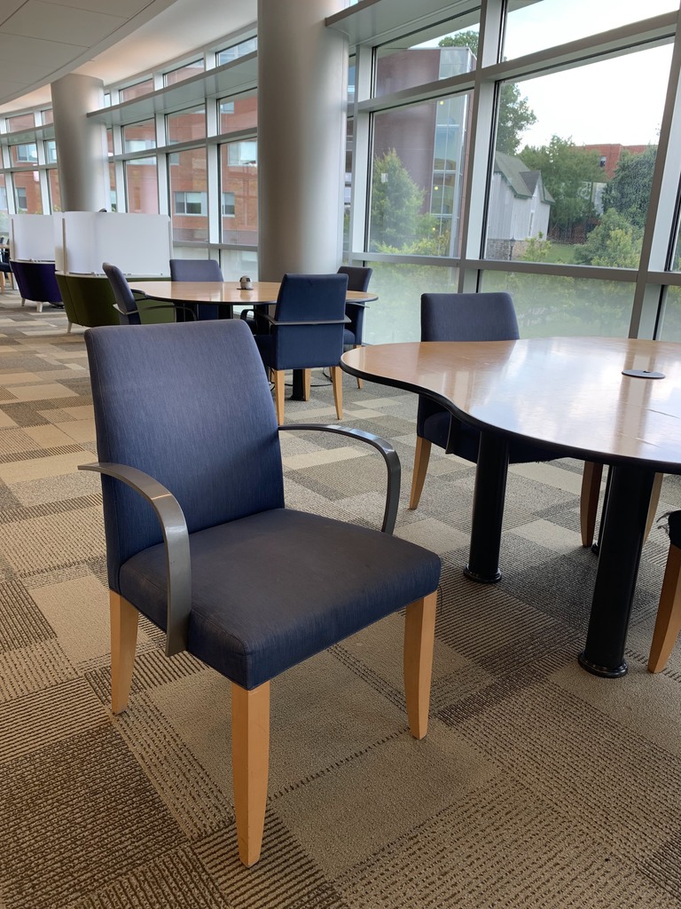 Stationary armchairs with blue upholstery and wooden legs