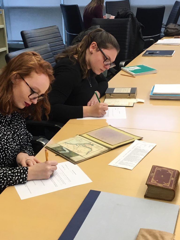 Students reviewing archival materials.